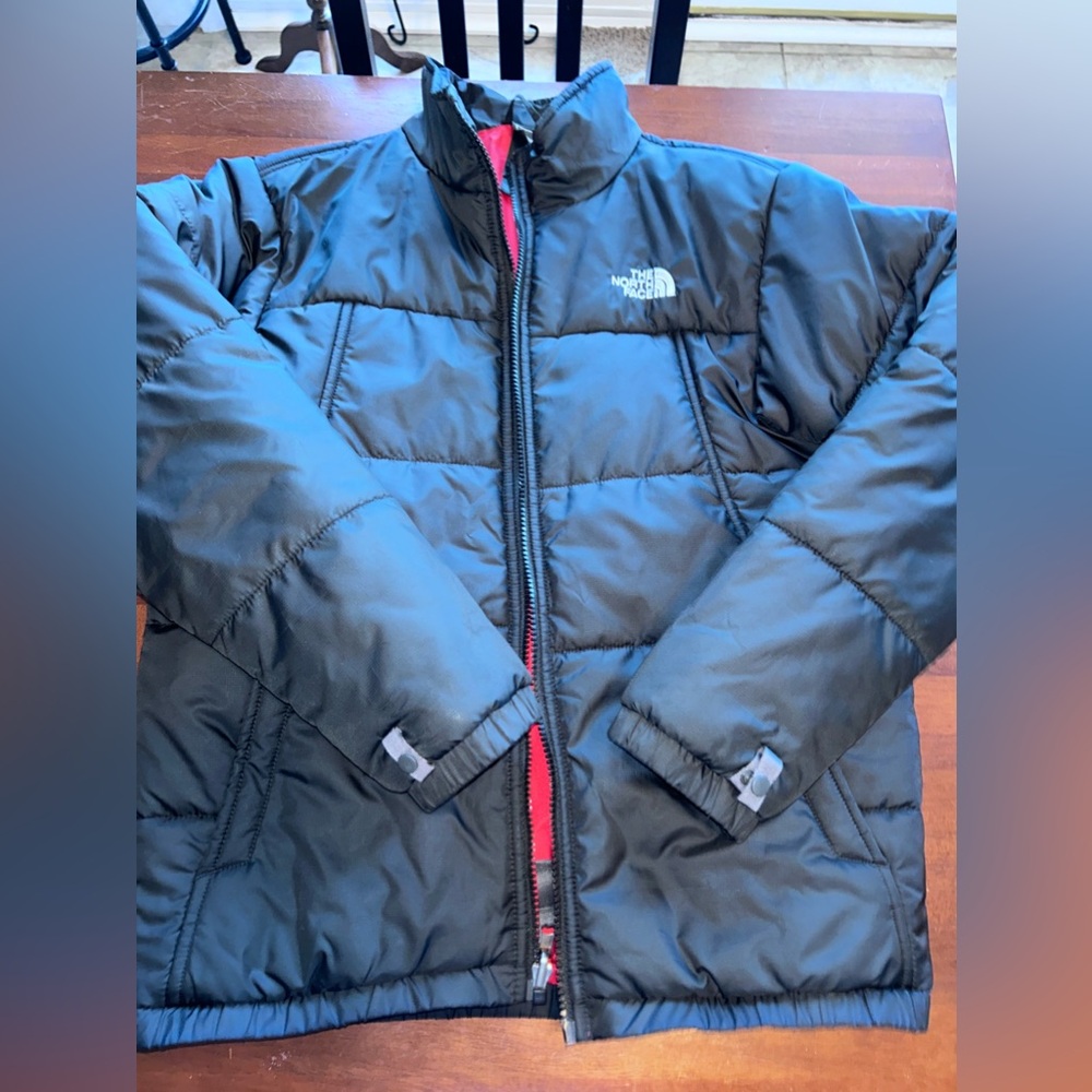 Boys black North Face jacket.